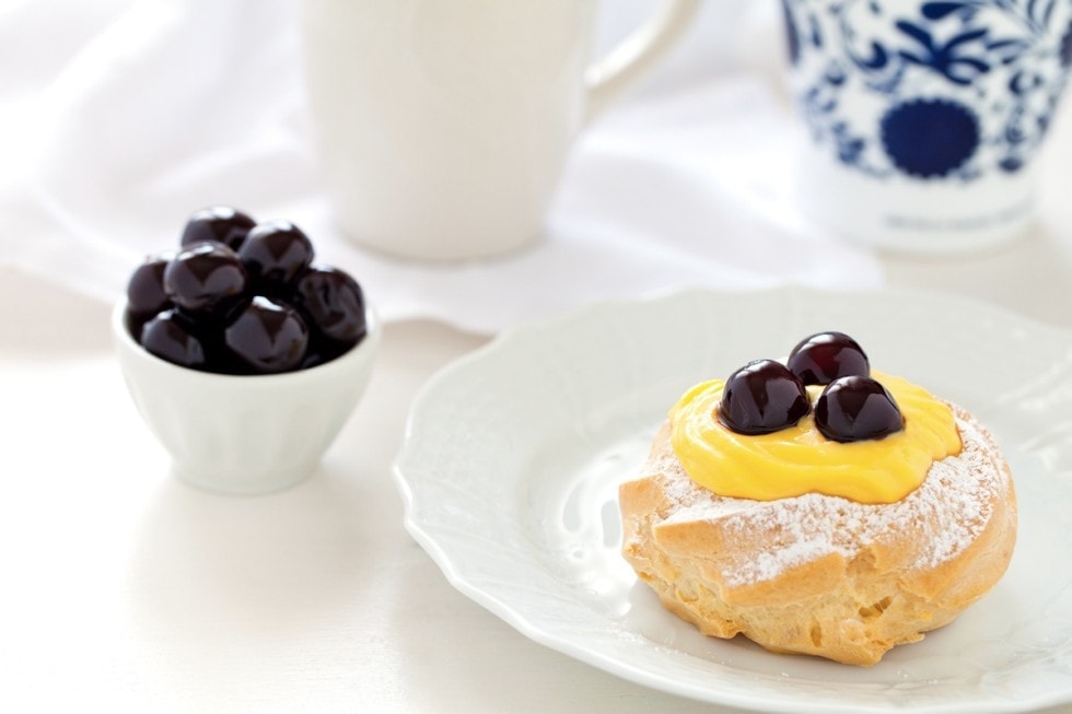 Zeppole with pastry cream and amarena cherry