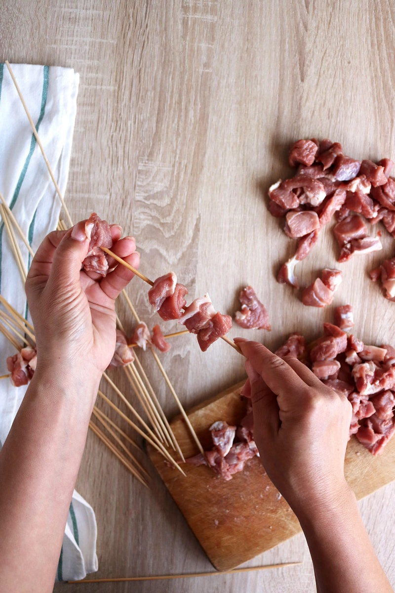 add the arrosticini meat in the skewers