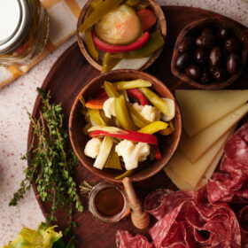 picture of giardiniera pickled vegetables served on a table with other appetizers