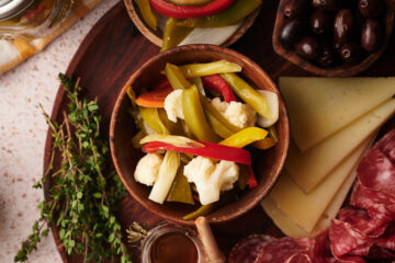 picture of giardiniera pickled vegetables served on a table with other appetizers