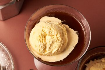 picture of affogato next to coffee beans and coffe maker