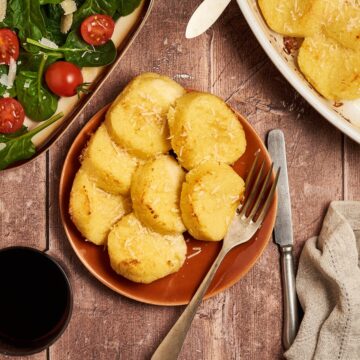 a dish of gnocchi alla romana served in a dish on a table
