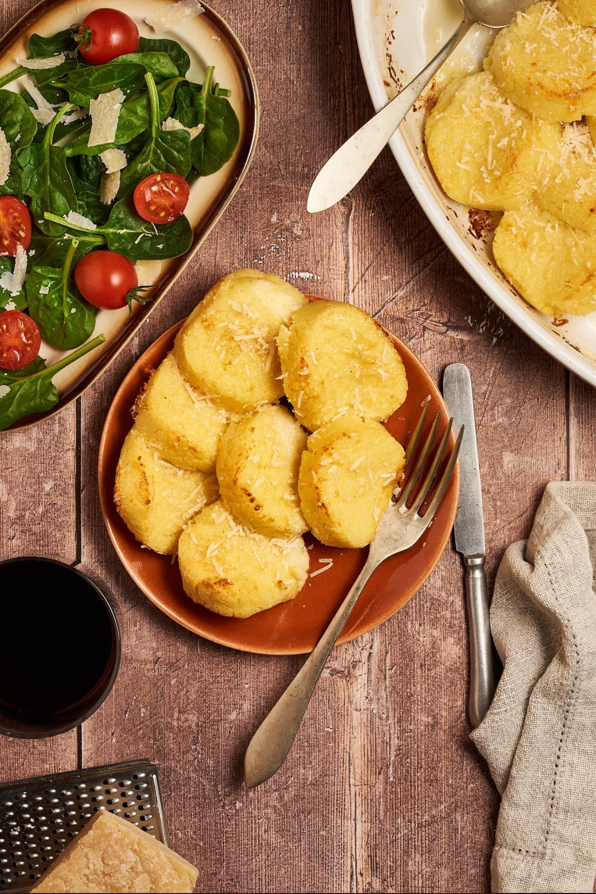 a dish of gnocchi alla romana served in a dish on a table