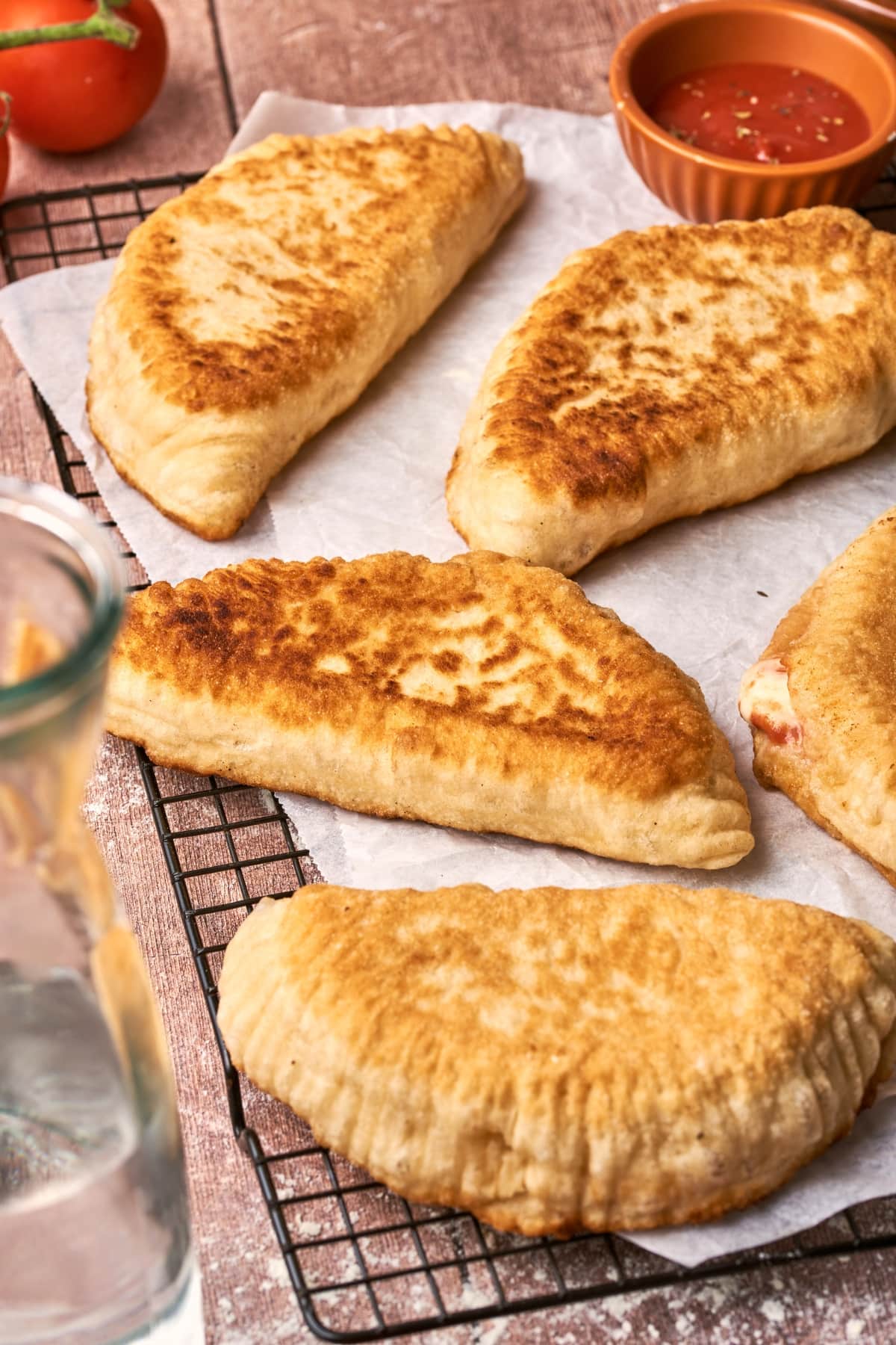 Panzerotti on a piece of white parchment paper.