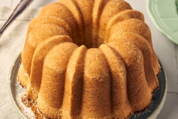 ciambella italian cake on a plate sitting on a table napkin.