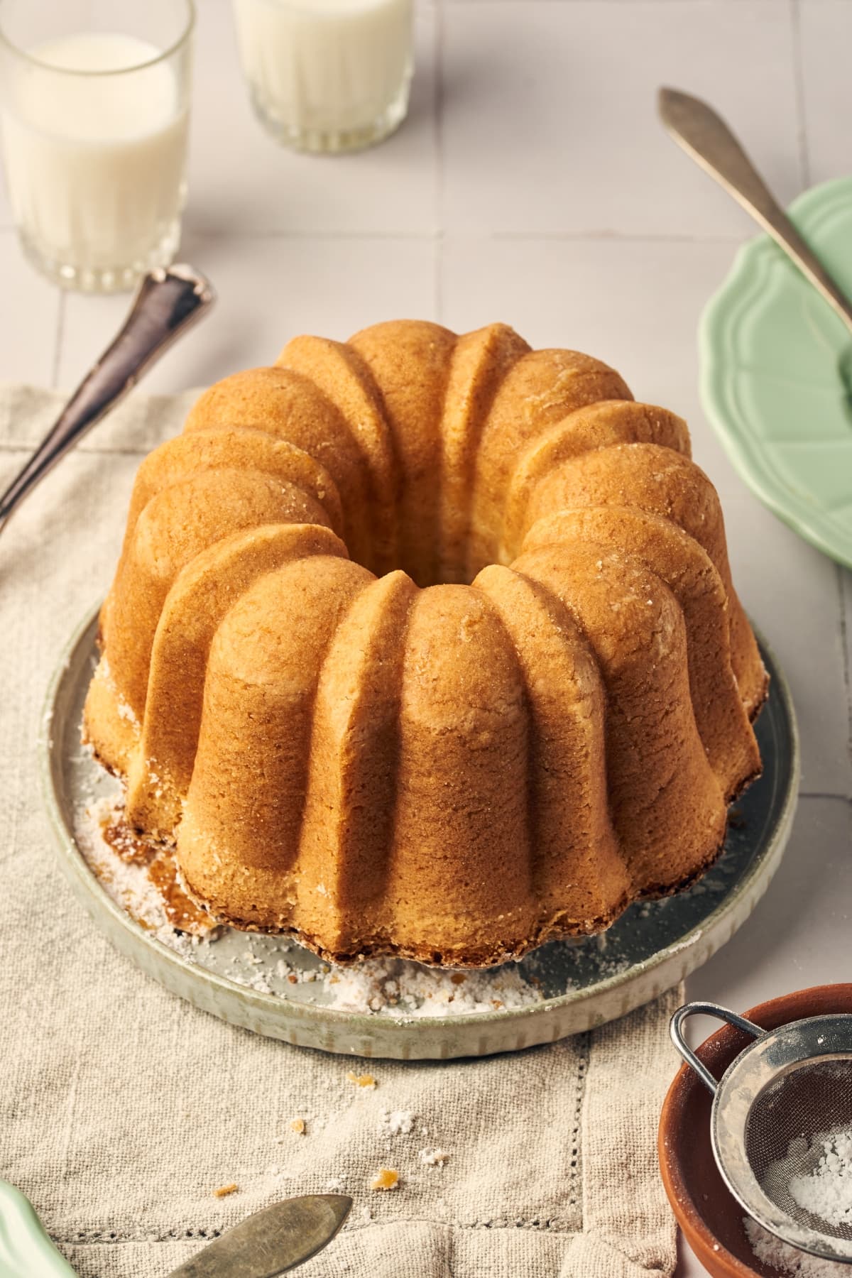 ciambella italian cake on a plate sitting on a table napkin.