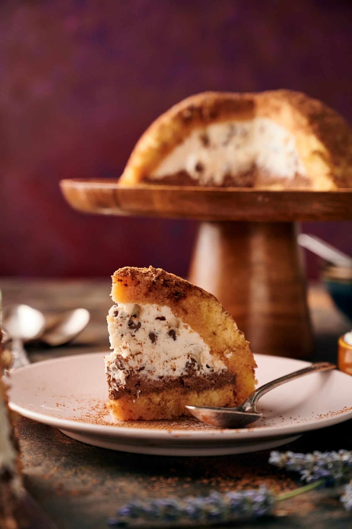 slice of zuccotto on a white plate with a spoon