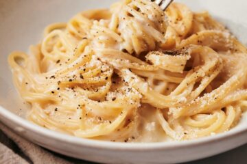 cacio e pepe dish on a white plate