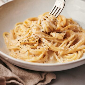 cacio e pepe dish on a white plate