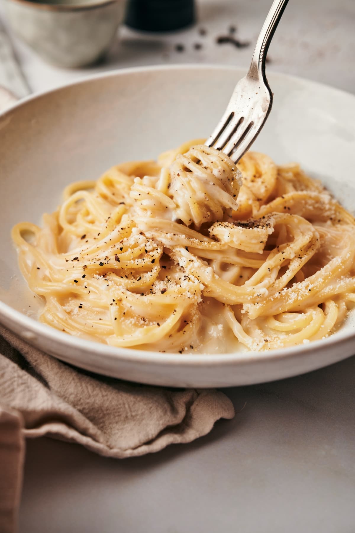 cacio e pepe dish on a white plate