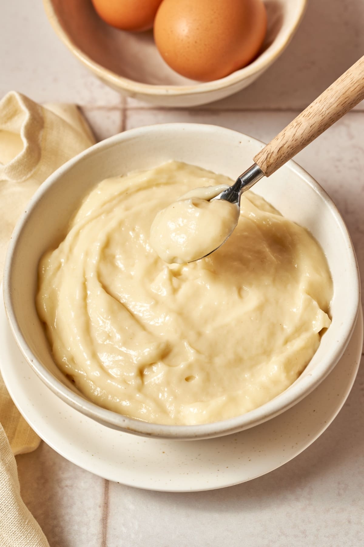 finished italian pastry cream in a bowl with a spoon
