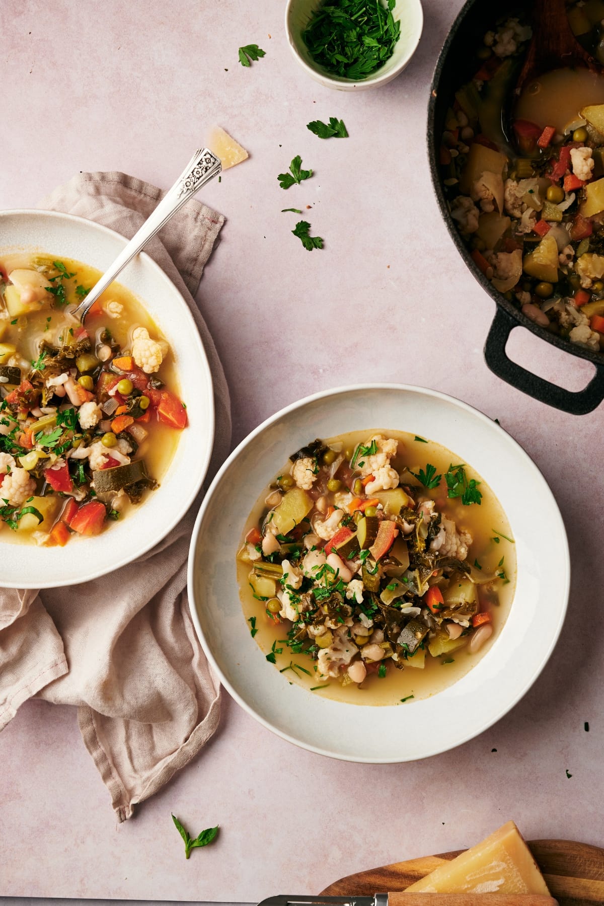 Image of minestrone soup in two bowls before serving.