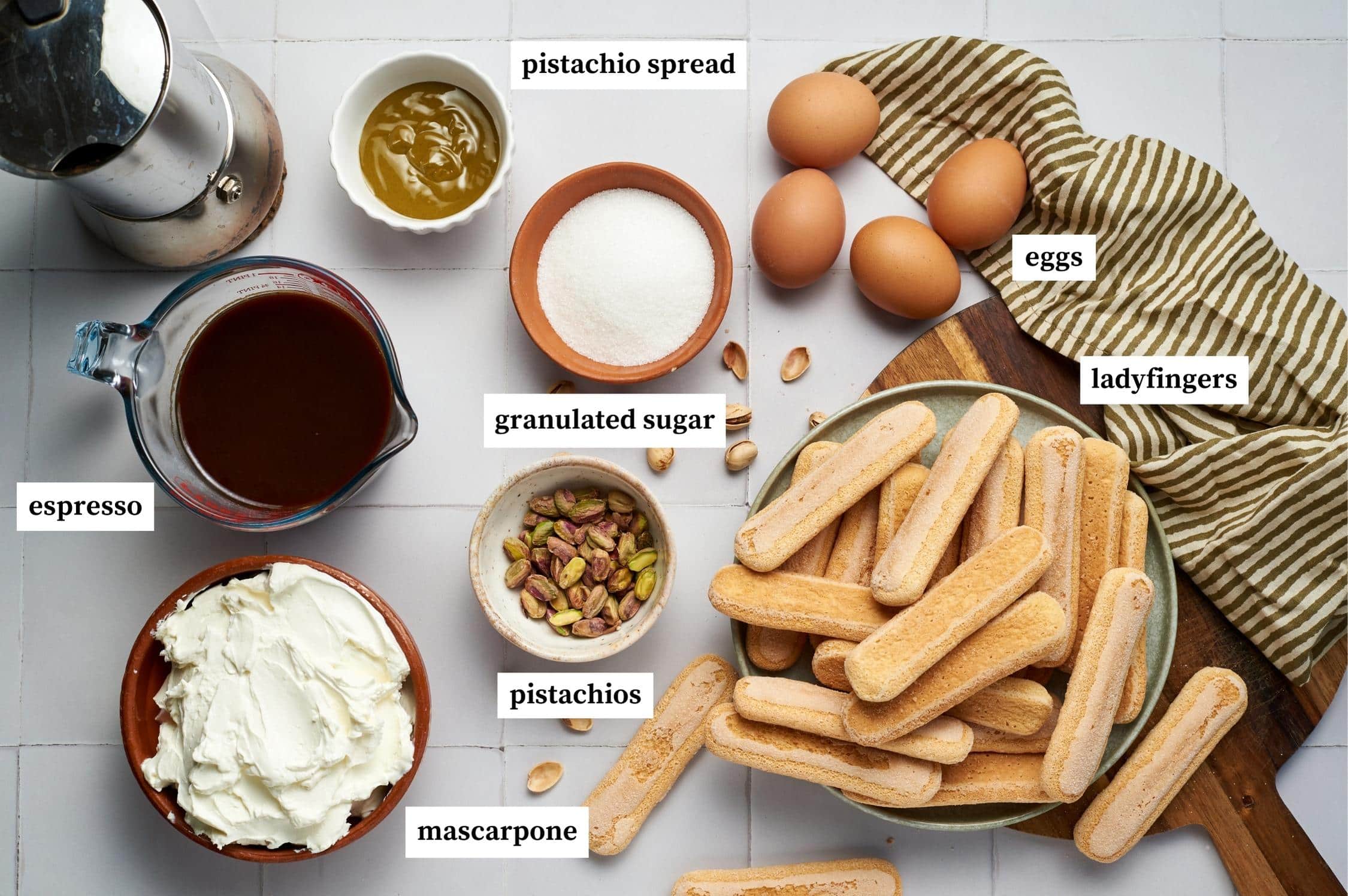 pistachio tiramisu ingredients on top of a counter