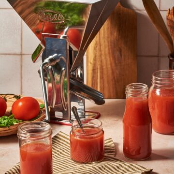 homemade tomato passata prepared in jars on a table