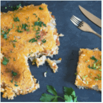 Creamy risotto cake with tomato, mozzarella and onion