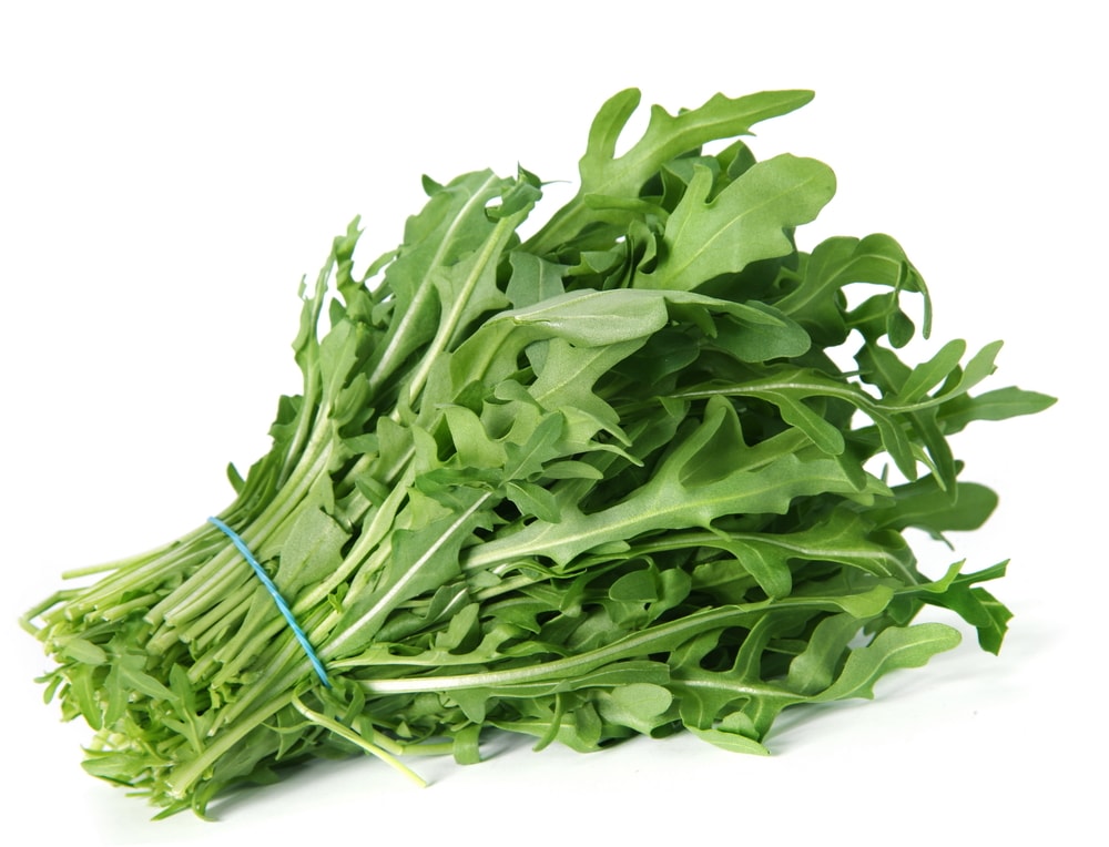 Arugula fresh heap leaf on white backgroung