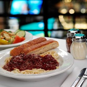 Homemade Italian spaghetti sauce goes well with red wine.