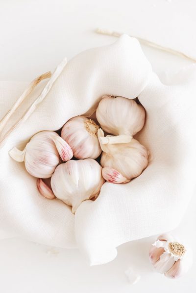 cloves of garlic in basket