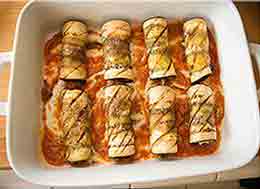 placing the eggplant on the tray